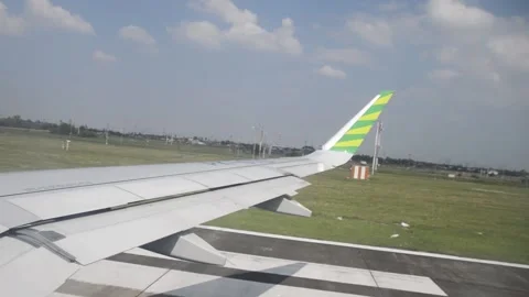 Plane Speeding Up Before Landing Shot from Wingside Stock Footage 154400482