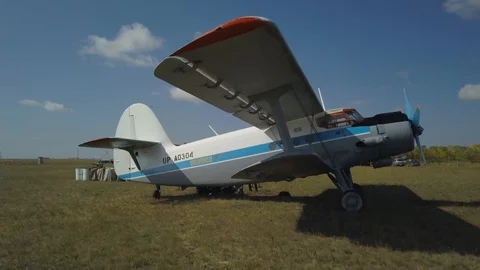 The plane stands on a small airfield next to the road. Stock Footage 102370491