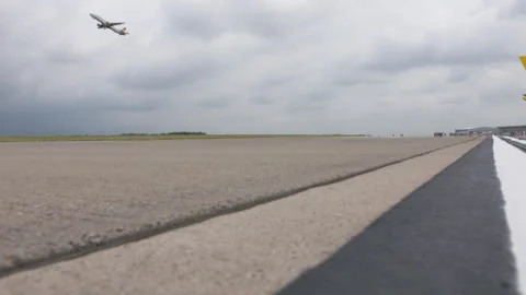 Plane starting with tarmac in foreground Stock Footage 248034167