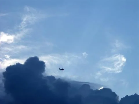 Plane in stormy sky 스톡 사진