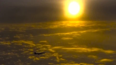 The plane in the sun and clouds Stock Footage 85603554