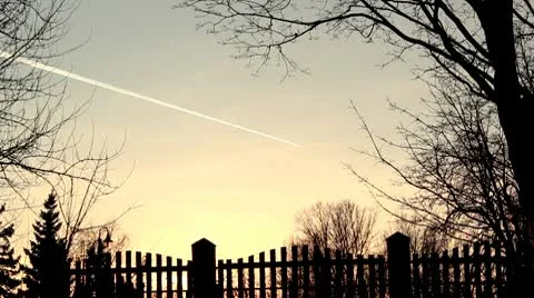 Plane in sunset sky DNxHD Stock Footage 10737490