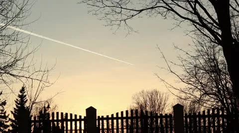 Plane in sunset sky ProRes Stock Footage 10724598