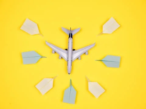 Plane surounded by paper planes Stock Photos