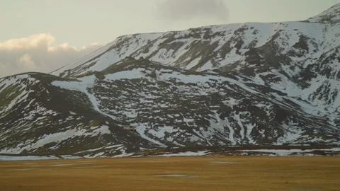 Plane tacking off arctic mountains snow Tundra 5K Stock Footage 128594353