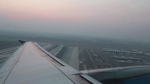 Plane take off at evening by passenger view from windows seat. Stock Footage 136886266