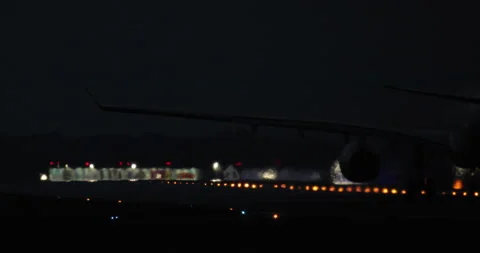Plane take-off On Night Airport Runway Stock Footage