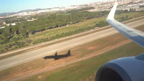 Plane take off shadow on the ground as it leaves the surface 動画素材 231479828