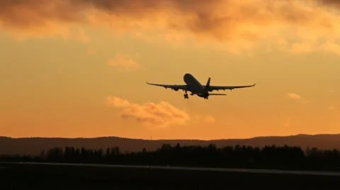 Plane take off at sunset Stock Footage