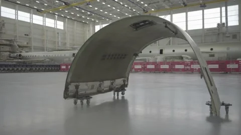 The plane is taken out of the hangar Stock Footage 164472932
