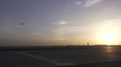 Plane takeoff in the distance and fly over Stock Footage 52819377