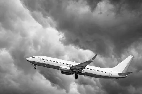 Plane at takeoff, the plane on background of clouds Stock Photos