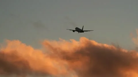 Plane takeoff at sunset Stock Footage 12612647
