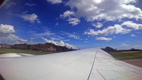 Plane takeoff, wing view of emirates flight from Seychelles to Dubai, 25fps Stock Footage 324882613
