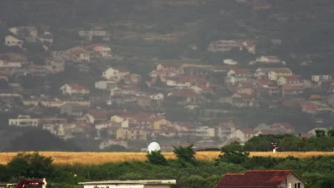 The plane takes off against the backdrop of the cityscape. Stock Footage 199011242