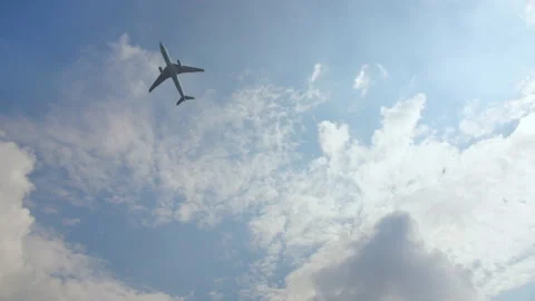The plane takes off against a blue cloudless sky. Stock Footage 103334666
