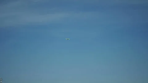 The plane takes off against a blue sky. Video stock 130874853