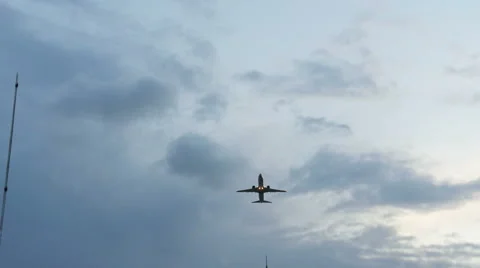 Plane takes off from the airport at sunset Stock Footage 53855152