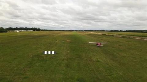 The plane takes off, the drone flies behind the planes Stock Footage 172089724