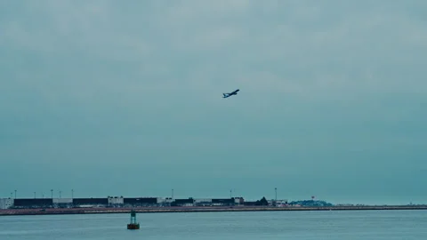 Plane takes off next to harbor Stock-Footage 331726356