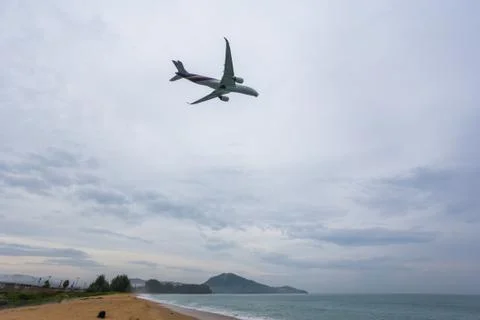 Plane takes off over the beach, Thailand airport beach Stock Photos