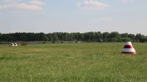 The plane takes off over the field. Stock Footage 82799017