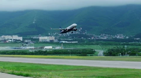 Plane takes off from the runway with moveing camera Stock Footage 62876083