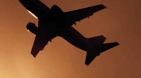 The plane takes off at sunset, on the fuselage moving solar reflection Stock Footage 56253297