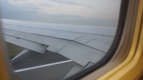 The plane takes off. View from the window. Stock-Footage 99358823