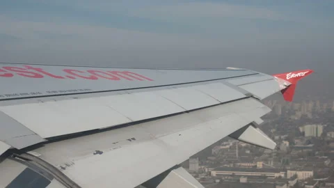 Plane taking off from airport, View through an airplane window Stock Footage 98287792