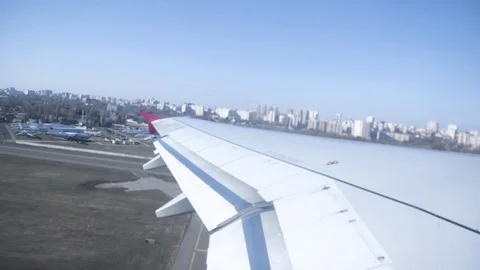 Plane taking off from airport, View through airplane window Stock Footage 121880326