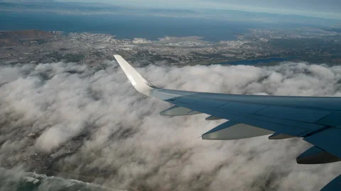 Plane taking off and flying in the clouds Stock Footage 154918325