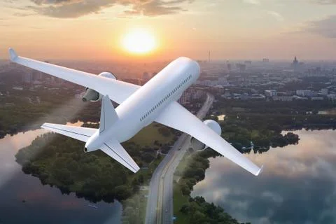 Plane taking off on the background of the city at sunset Stock Illustration