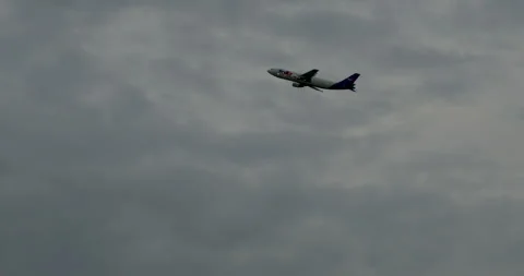 Plane taking off in cloudy sky, Winnipeg Canada - AUGUST 15 2024 Stock Footage 282771326
