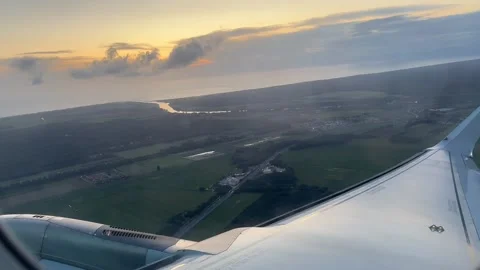 Plane taking off in Italy at twilight with sunset on horizon Stock Footage 260242169