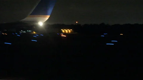 Plane taking off night Stock Footage 1072442