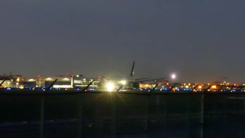 Plane taking off at night Stock Footage 139664467