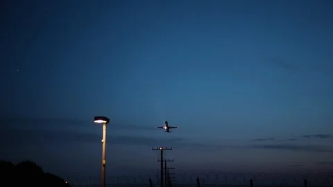 Plane taking off in a night sky Stock Footage