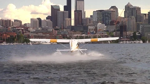 Plane taking off on the ocean in Seattle Stock Footage 72478756