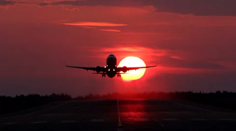 Plane taking off, passing sun in the morning Stock Footage 36765082