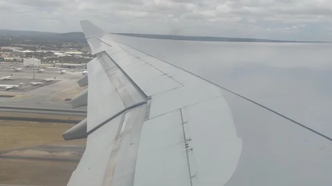 Plane taking off from Perth going into sky, 4K Stock Footage 122662583