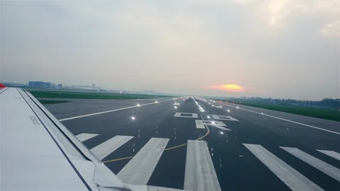 Plane taking off from runway and flying over airport 4k Stock Footage 94143260