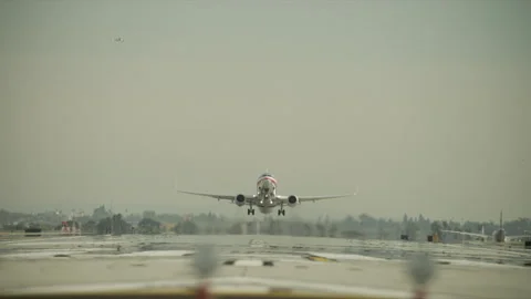 Plane taking off on runway Stock Footage 197493027
