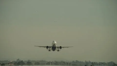 Plane taking off on runway Stock Footage 197493036