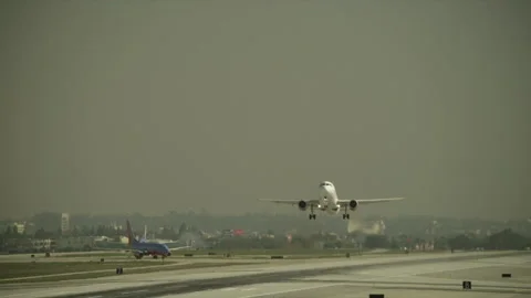 Plane taking off on runway Stock Footage 197494901