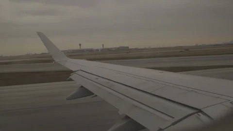 Plane Taking Off From Runway Window View On Wing Stock Footage 118096163