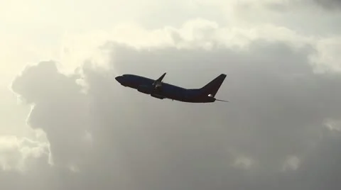 Plane taking off into the sunlight Stock Footage 10734668