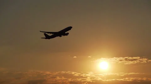 Plane taking off at sunset Stock Footage 26595631