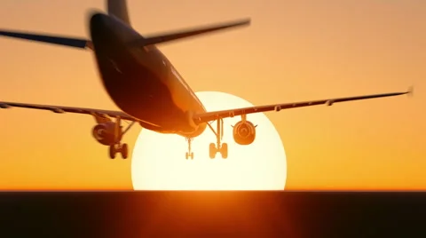 Plane taking off on sunset or sunrise Stock Footage