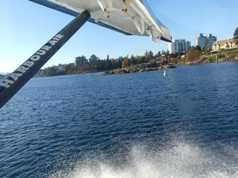 Plane taking off from water sunny day Vancouver BC Canada Oct 2017 Stock Footage 81846302